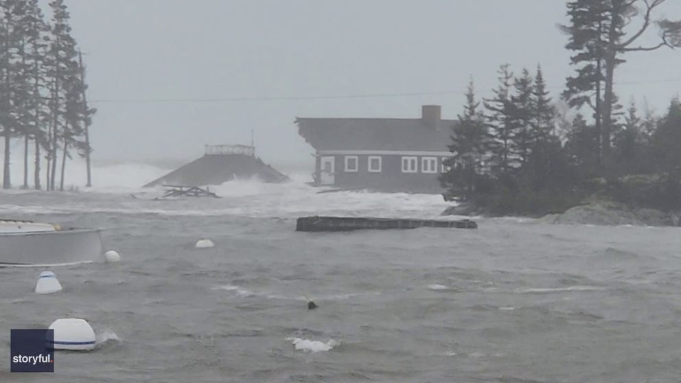 Video captured on Wednesday shows the moment waves washed away a waterfront cookhouse in Georgetown, Maine. (Courtesy: John Thibodeau via Storyful)