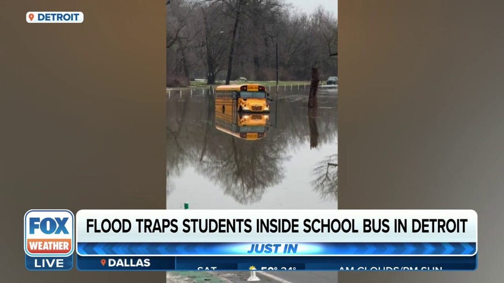  A school bus with students was trapped on a flooded roadway on Friday afternoon outside of Detroit.