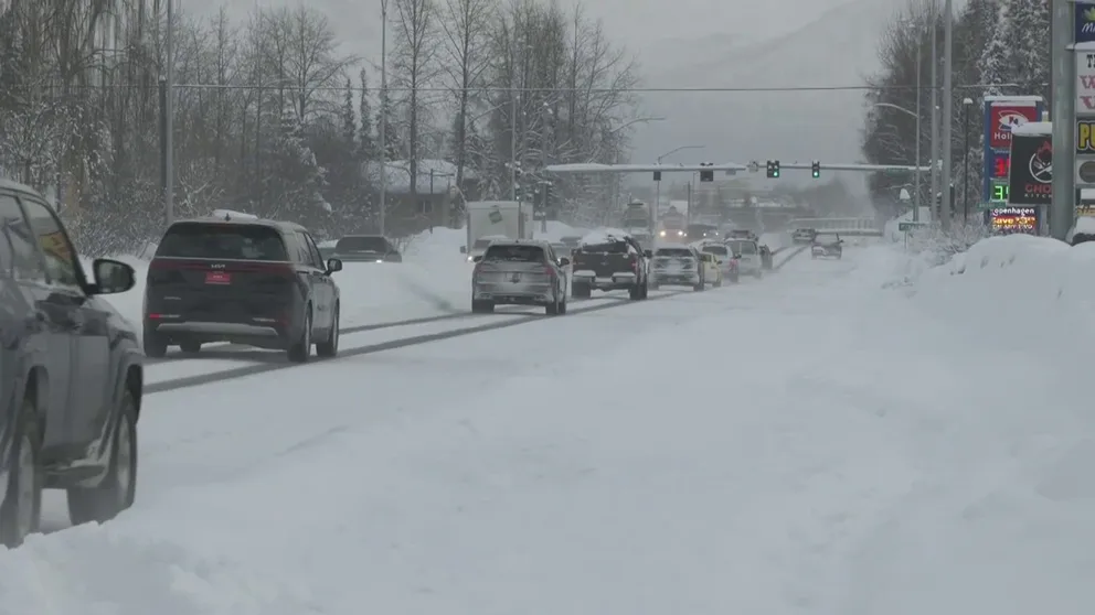 Video recorded in Anchorage, Alaska, shows people working to clear snow and travel on snow-covered roads. Anchorage has received more than 100 inches of snow so far this winter.