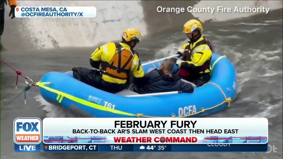 Rescue crews saved a man from a waterway that was swollen from heavy rain in Costa Mesa, California.