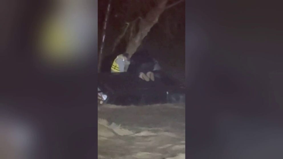 A firefighter shared this video with FOX Weather. Three people in a car towing a trailer tried to cross a flooded road in Cajon, California. But, rushing waters took the vehicle. The trio escaped the water-filled car and climbed a tree to wait for help