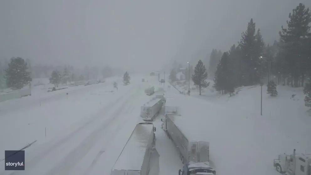 Video recorded in California shows a line of vehicles trapped on a snow Interstate 80 during a blizzard that brought several feet of snow to the Sierra Nevada mountains.