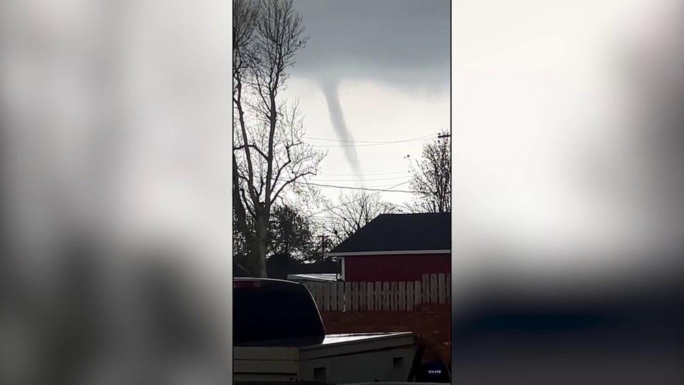 A funnel cloud was spotted in central Oklahoma on Monday as the National Weather Service put the region under a Tornado Watch. Footage filmed by Kristy Turner shows the funnel moving across the town of Kingfisher, northwest of Oklahoma City.