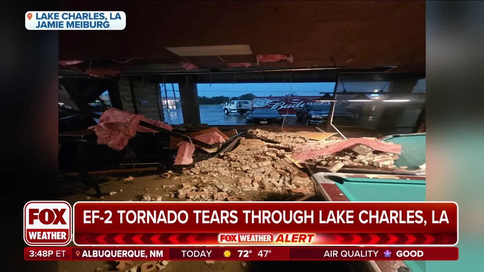 Bar owner Jamie Meiburg felt his bar shaking, then gathered the patrons and brought them to shelter before an EF-2 tornado tore down a wall. A security camera caught it all.