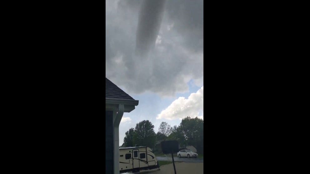 "It's over my f_______ house," the homeowner yells on the video. She said the funnel was a tornado, on the ground, previously in Westmoreland, Kansas. She was also pelted by debris which presumably prompted her to stop recording.