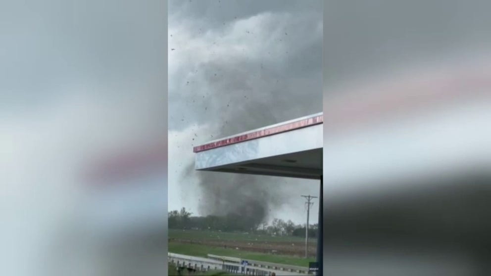Video recorded by Buster Schmitz shows debris flying through the air as a large funnel cloud forms overhead during a tornado in Westmoreland, Kansas, on Tuesday, April 30, 2024. 