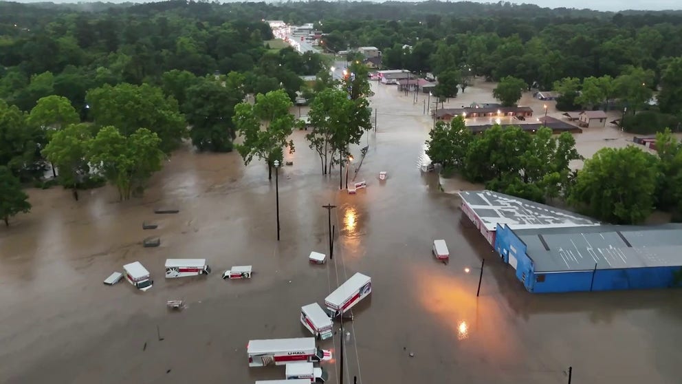 Drone video shows mile after mile of Livingston, Texas literally underwater. The white boxes are not floating in a river but U-Haul trucks in the flooded parking lot.