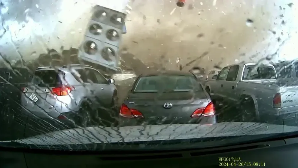 Incredible dash-cam video from a parked car shows the April 26 tornado dismantling a building in Lincoln, Nebraska. Amazingly, the car was fine while the building was destroyed.