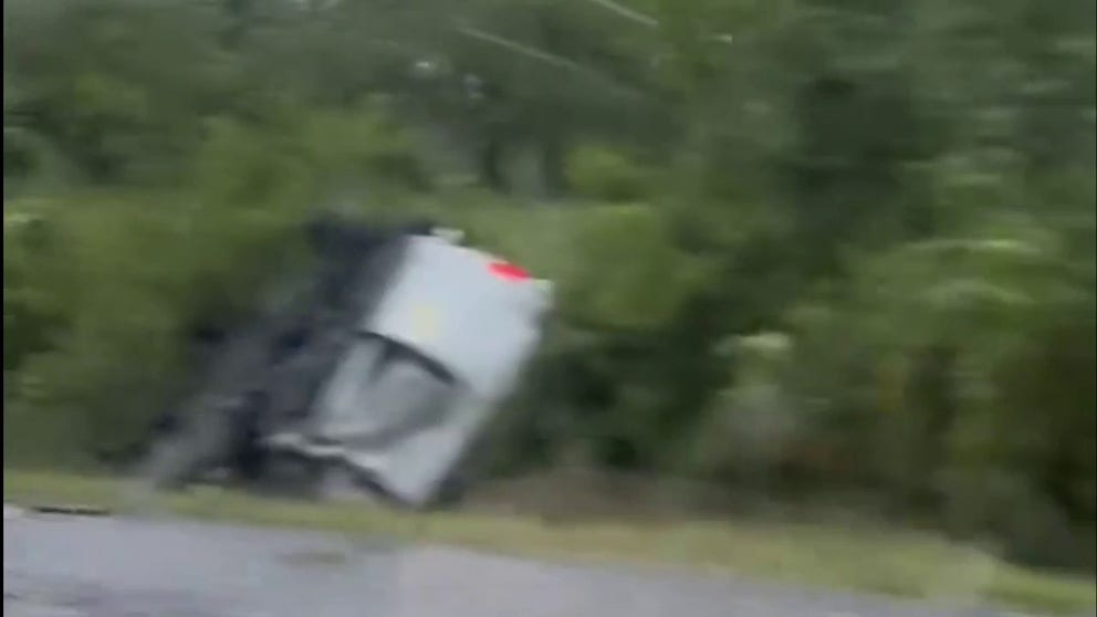 At least one car was flipped on I-65 south of Nashville during Wednesday's tornadoes in Tennessee.