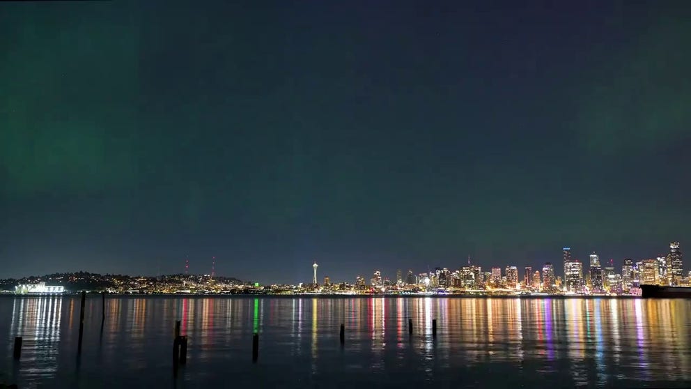 A stunning time lapse video shows the Northern Lights dancing about the Seattle skyline on Friday, May 10, 2024.