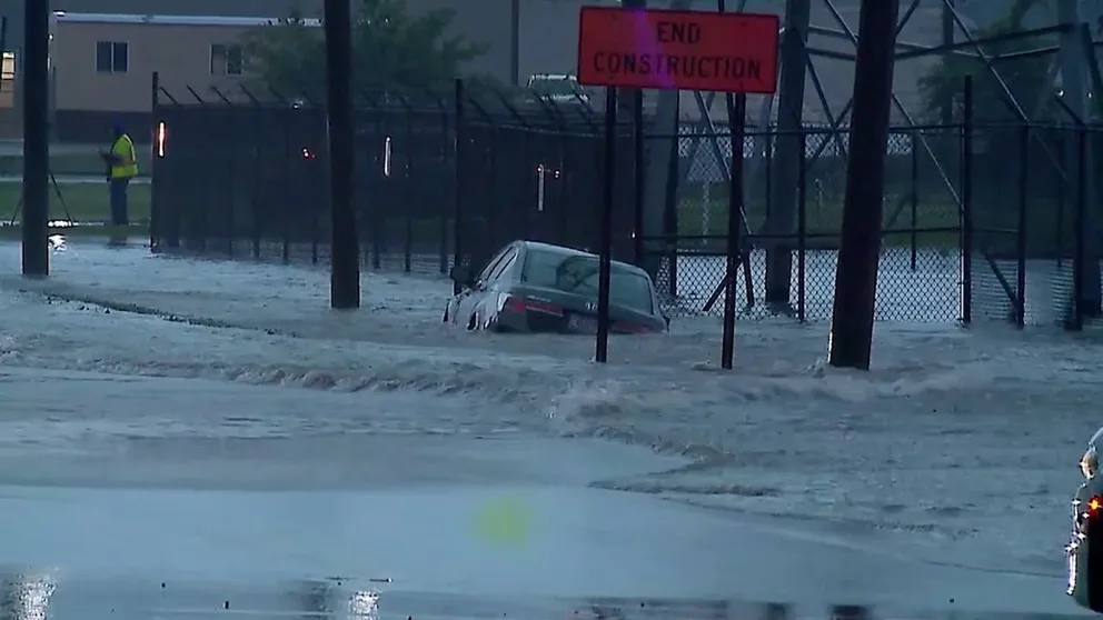 Heavy rain pounded the Indianapolis area on Wednesday, making some roads impassable as cars became partially submerged. 