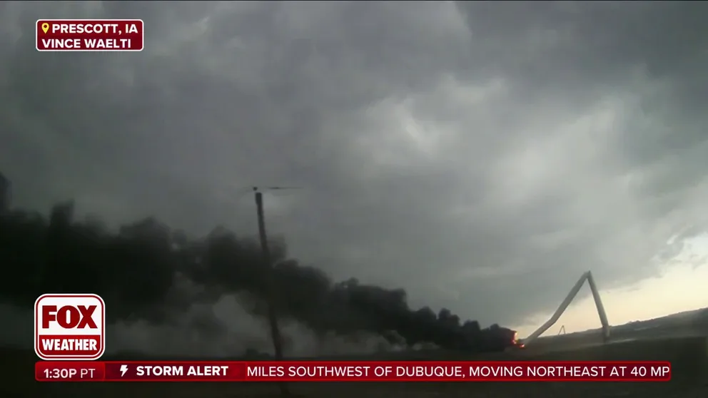Storm Tracker Vince Waelti is following in the wake of the tornado and has seen at least 5 wind turbines snapped in half by a tornado in Prescott, Iowa. Black smoke billows from the burning turbine and fills the sky that is already clearing.