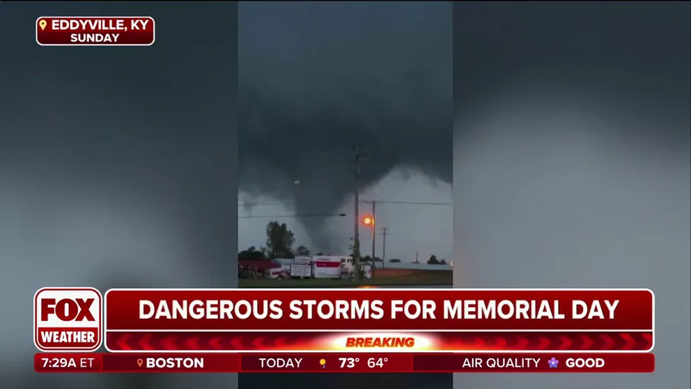 Video captured a tornado on the ground near Eddyville, Kentucky, on Sunday after the National Weather Service issued a rare "Tornado Emergency" for the small city some 30 miles east of Paducah.