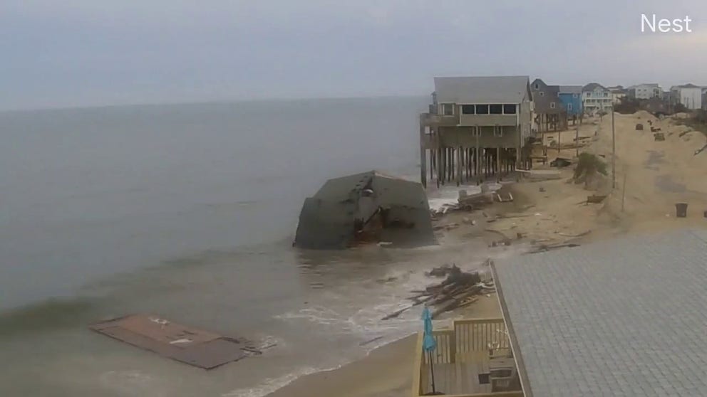 A time-lapse video shows a home that collapsed into the Atlantic Ocean along North Carolina's Cape Hatteras National Seashore and work completed to remove it from the water.