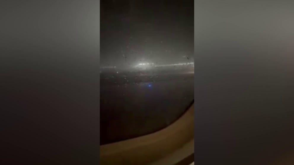 A plane filled with passengers had to stay on the runway at Chicago O’Hare International Airport amid tornado-warned storms that killed at least one person on Monday, officials said.