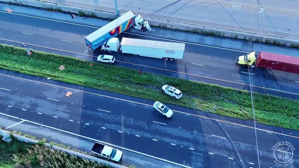 Drone video from the Chicago & Midwest Storm Chasers shows extensive damage along I-55 near Channahon, Illinois where powerful winds flipped tractor trailers and brought down powerlines. 
