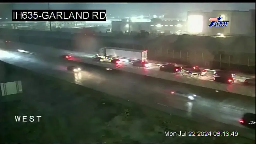 A video from the Texas Department of Transportation shows vehicles attempting to travel over a flooded Interstate 635 in Dallas after as much as 3 inches of rain fell on Monday morning.