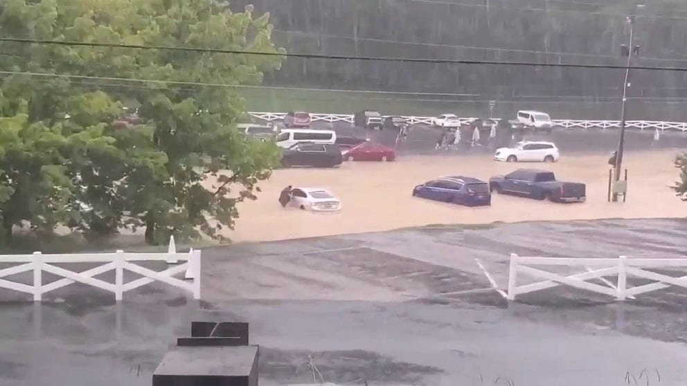 A video recorded at Dollywood in Tennessee shows a parking lot that was flooded after severe weather and torrential rain hit the Pigeon Forge area on Sunday, July 28, 2024.