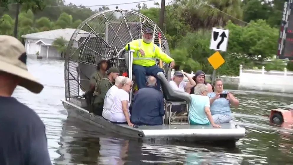 FOX 13 Tampa Photojournalist Omar Delgado shared a video showing Sarasota residents and pets being rescued from flooding caused by the torrential rain from Tropical Storm Debby.