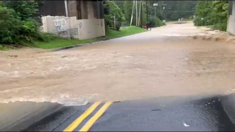 A video shared by the Monroe Police Department in Connecticut shows rushing floodwaters covering a road on Sunday, Aug. 18, 2024. Catastrophic flooding was reported in many parts of Connecticut on Sunday as relentless rain pounded the region.