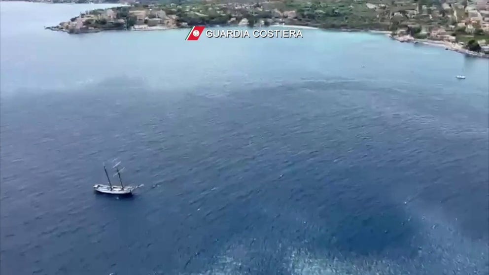 Aerial video shows the area off Porticello, Italy where Coast Guard crews continue to search for the remaining passengers and crew of the Bayesian yacht owned by the wife of British tech tycoon Mike Lynch. Lynch and his daughter are among the six missing. 