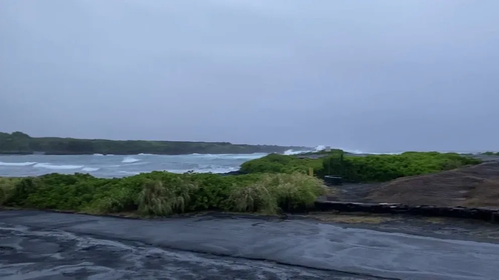 Rough surf created by Hurricane Hone passing south of the Big Island creates tide pools at Black Sand Beach in Punalu'u.