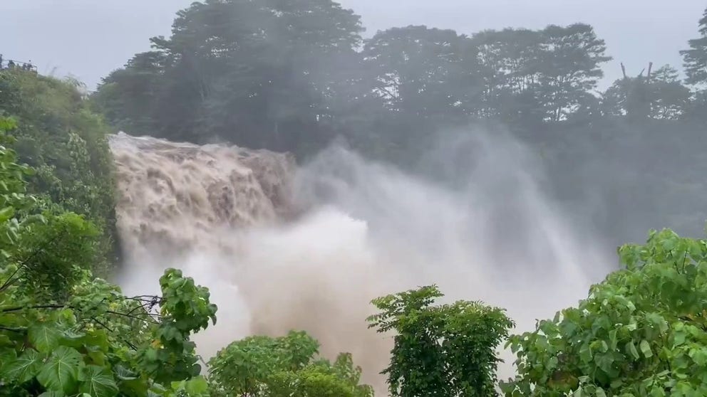 Powerful beauty after Hurricane Hone's torrential rainfall, as onlookers watch Rainbow Falls in Hilo, Hawaii on Aug. 25, 2024. 