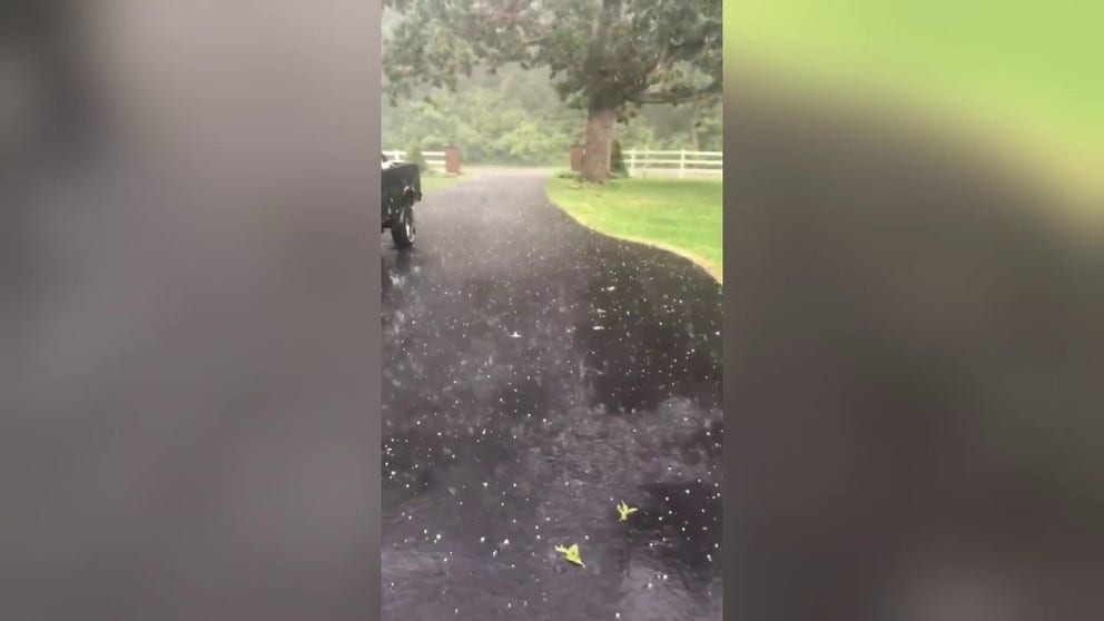 A video shared from Harvard, Illinois, shows hail falling from the sky and slamming into the pavement as severe weather pushed through portions of the Great Lakes region and Midwest on Tuesday.