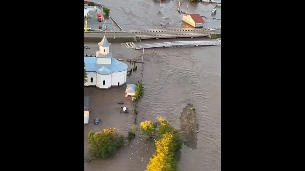 Aerial footage of flooding in Pechea on Saturday. Footage released by Footage released by the Romanian water supplier Apele Romane. 