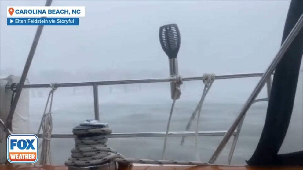 This footage was filmed by Eitan Feldstein on Monday, who said he was sailing from Cape Canaveral to Chesapeake Bay before getting stuck in the storm at Carolina Beach since Sunday.