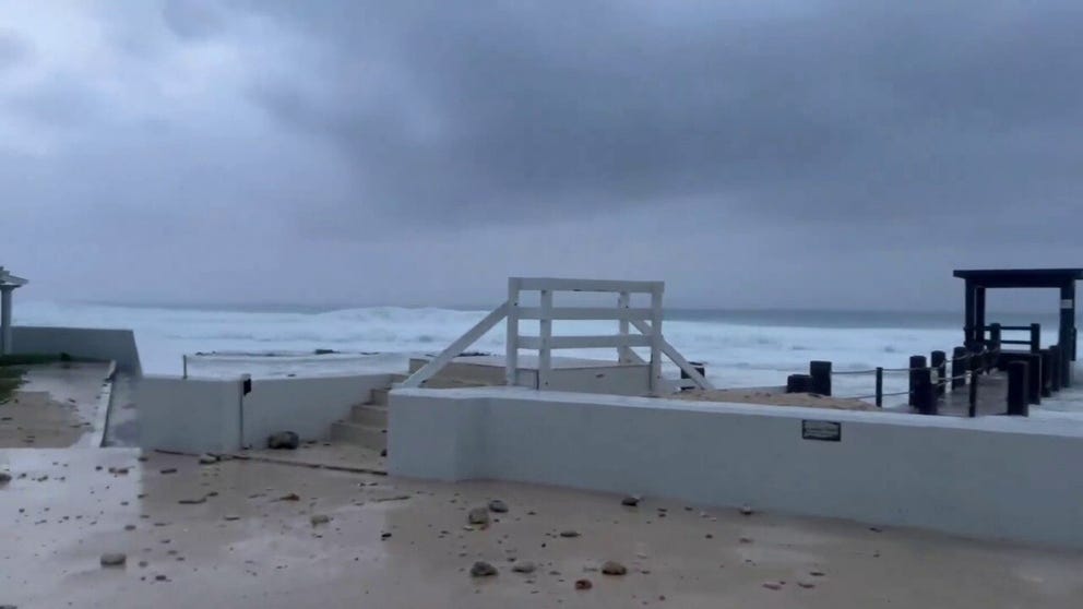 Tropical Storm Helene formed in the Caribbean Sea on Tuesday, and video recorded in Grand Cayman shows winds from the storm whipping while large waves crash onshore.