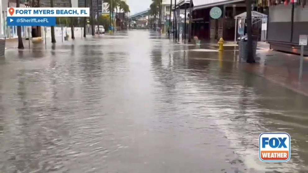 Floodwaters pooled along Florida’s southwestern coast on Thursday as locals braced for the arrival of Hurricane Helene.