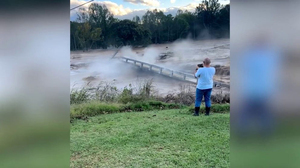 Watch a road bridge in East Tennessee collapse into a river. Known as Kisner Bridge on Highway 107 in the town of Afton, the bridge was no match for the powerful waters of the flooded Nolichucky River. (Courtesy: Landon Duckett via Storyful)