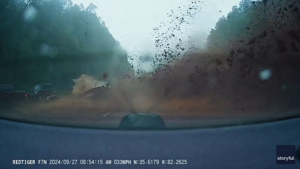 Dashcam footage shot on Friday morning shows the moment a couple barely escaped a mudslide that came crashing onto an interstate in North Carolina’s Blue Ridge Mountains. (Courtesy: James White via Storyful)