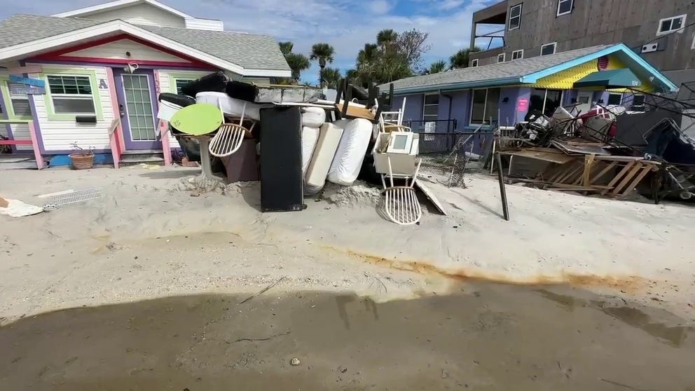 Scenes from Bradenton Beach, Florida show the debris piles lining the streets left from Hurricane Helene. Hurricane Milton is forecast to make landfall on Wednesday causing up to 12 feet of storm surge.