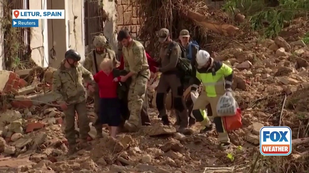 Members of Spanish military emergency unit rescued an elderly couple in the devastated town of Letur, in Castille La Mancha region on Wednesday.