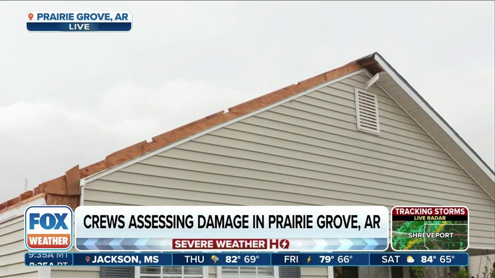 FOX Weather's Brandy Campbell talks to the residents of a home in Prairire Grove, Arkansas, whose roof was ripped off during the storms. 