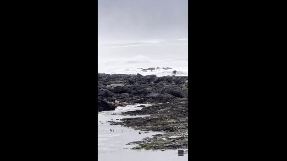 Video shot on Friday shows three men being battered by powerful waves crashing onto Ke Iki Beach in northern Oahu. (Courtesy: Matt Moore via Storyful)