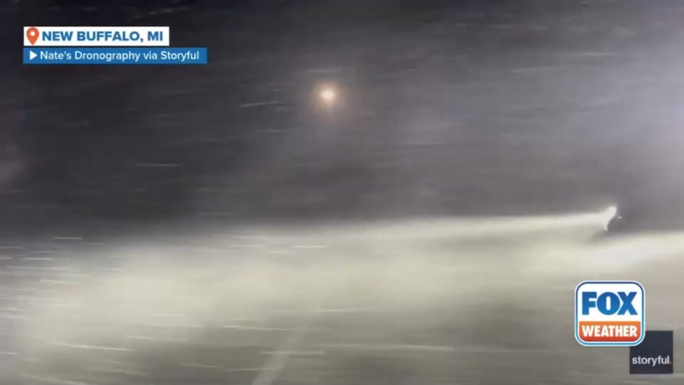 A videographer captured intense weather conditions in Michigan in the early hours of Thursday, as the Great Lakes region was hit by lake-effect snow. Footage by Nathan Voytovick shows strong winds, blowing snow, and poor visibility at New Buffalo Beach. Voytovick described the weather in New Buffalo as 