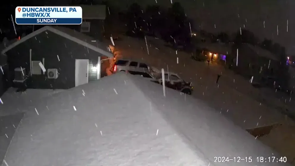 A video recorded in Duncansville, Pennsylvania, shows snow falling during a storm that moved through the region on Sunday, Dec. 15, 2024.