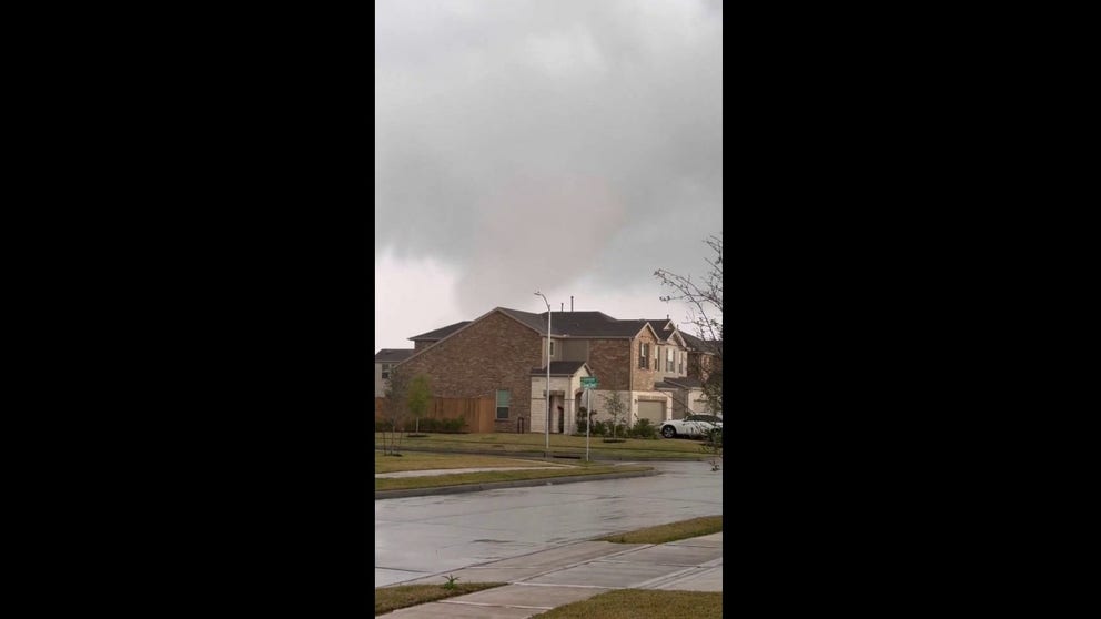 Debris can be seen swirling in the air in this video of a tornado that happened near Katy, Texas, on Saturday.