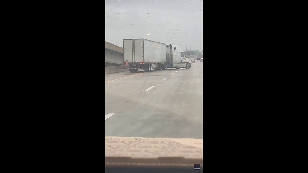 A woman caught the terrifying moment a semi-truck slid across multiple lanes of traffic and jackknifed on a highway in Kansas City, Missouri, on Saturday, January 4, as a major winter storm moved through the region (Video Credit: Gracie Fudge via Storyful).