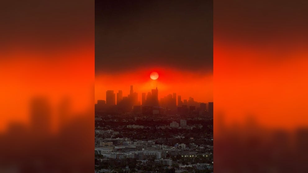 Video from West Hollywood shows the wildfire smoke interacting with the sun, turning the sky bright, hazy red. Three fires are impacting the area, burning thousands of acres. 