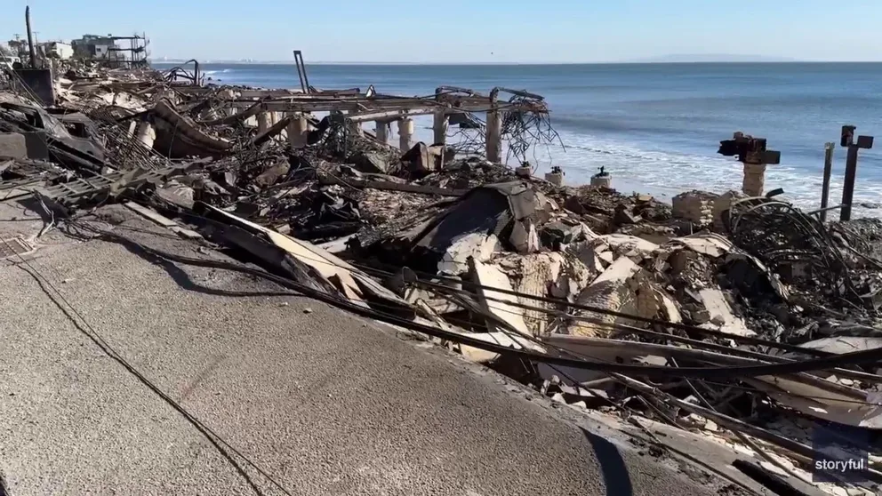 A man and woman from Malibu visited the smoldering remains of their house after the Palisades Fire burned dozens of homes along the Pacific Coast Highway. 