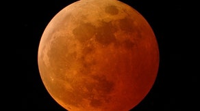Why does the moon turn red during a lunar eclipse?