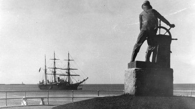 Fisherman’s Memorial Statue, M.N.t.s. Nantucket in background, Gloucester, MA., 1930s. Photograph by John C. Adams.