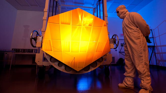 This is a photo of one of the James Webb Space Telescope's primary mirror segments coated with gold by Quantum Coating Incorporated. It's NOT a flight segment, it's the engineering design unit. The photo was taken at BATC by Drew Noel.