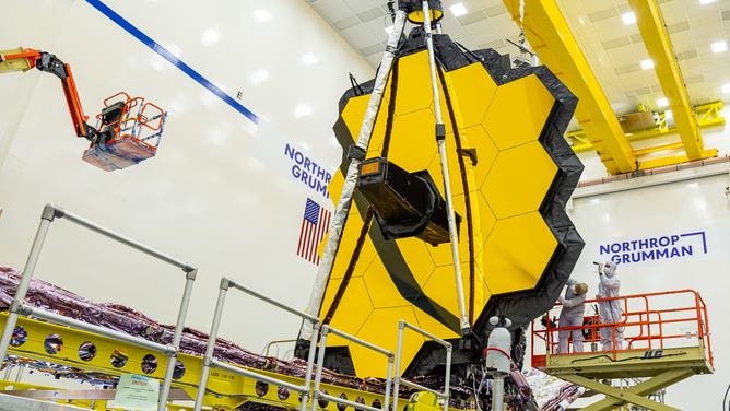 These images were captured during Webb's final tests when the 6.5 meter (21 feet 4 inch) mirror was commanded to fully expand and lock itself into place, just like it would in space. The conclusion of this test represents the team’s final checkpoint in a long series of tests designed to ensure Webb’s 18 hexagonal mirrors are prepared for a long journey in space, and a life of profound discovery. After this, all of Webb’s many movable parts will have confirmed in testing that they can perform their intended operations after being exposed to the expected launch environment.