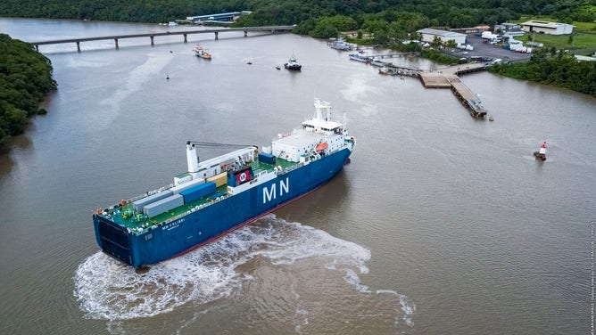 This image shows the arrival of the James Webb Space Telescope to Port de Pariacabo in French Guiana. It traveled from California, through the Panama Canal, aboard the MN Colibri, arriving October 12, 2021.