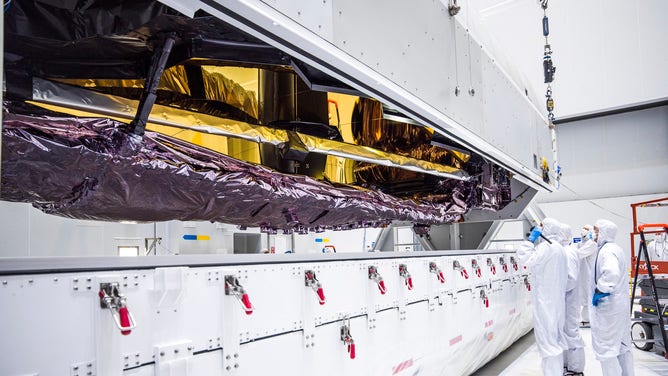 This image shows the James Webb Space Telescope being taken out of the special container in which it was transported to Kourou.